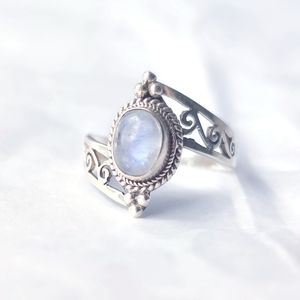 Moonstone & sterling silver ring with open scrollwork band